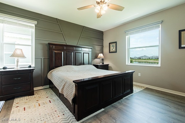 3943 E Hampton Cir, Alva, FL 33920 - bedroom featuring a decorative wall, light wood finished floors, and a ceiling fan