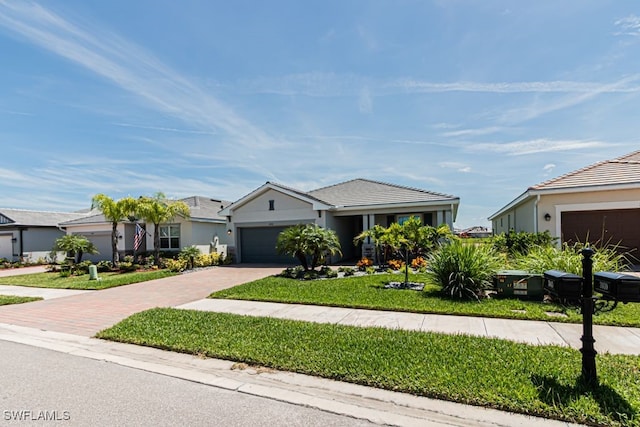 3943 E Hampton Cir, Alva, FL 33920 - ranch-style home featuring driveway, a garage, a front lawn, and stucco siding