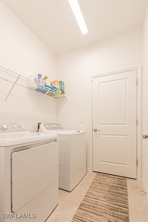 3943 E Hampton Cir, Alva, FL 33920 - washroom featuring washer and clothes dryer and light tile patterned flooring