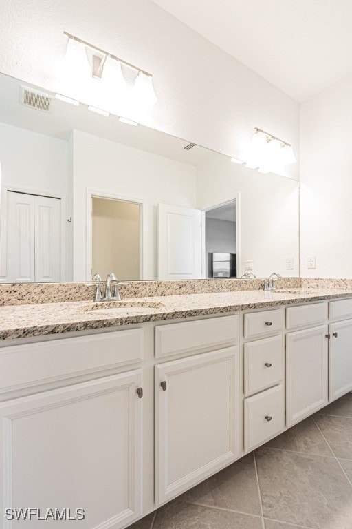 3943 E Hampton Cir, Alva, FL 33920 - bathroom with double vanity and tile patterned floors