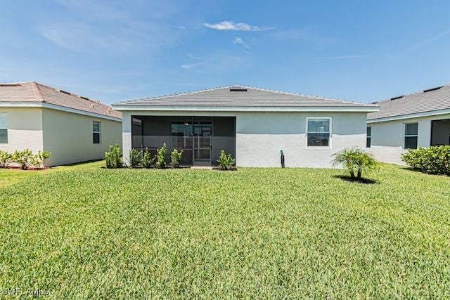 3943 E Hampton Cir, Alva, FL 33920 - rear view of property featuring a yard, a sunroom, and stucco siding