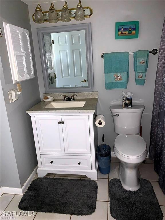 8701 Estero Blvd Unit 605, Bonita Springs, FL 33931 - full bathroom featuring vanity and tile patterned floors