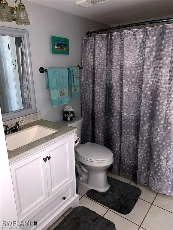 8701 Estero Blvd Unit 605, Bonita Springs, FL 33931 - bathroom with tile patterned flooring and vanity