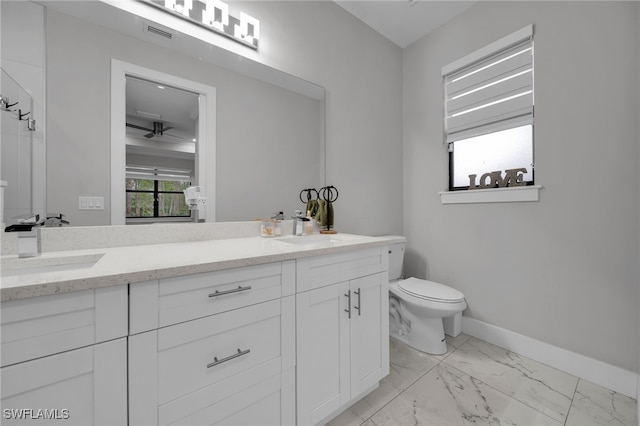 4267 4th Ave SE, Naples, FL 34117 - full bathroom with double vanity, marble look tile flooring, and a ceiling fan