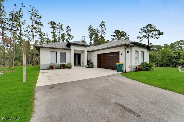 4267 4th Ave SE, Naples, FL 34117 - prairie-style home featuring stucco siding, a front lawn, driveway, french doors, and an attached garage
