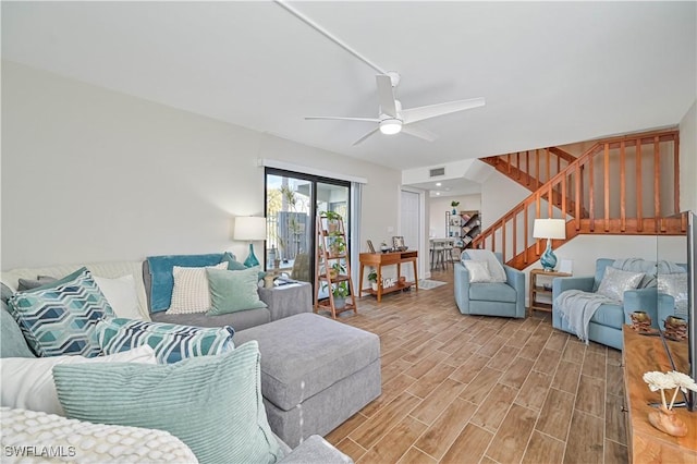 6296 Sugar Bush Ln Unit A, Fort Myers, FL 33908 - living area with stairs, ceiling fan, and light wood-style floors