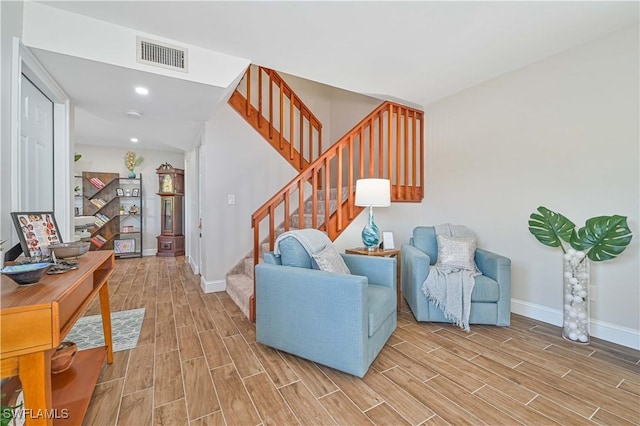 6296 Sugar Bush Ln Unit A, Fort Myers, FL 33908 - living area featuring light wood-style flooring, stairway, and recessed lighting