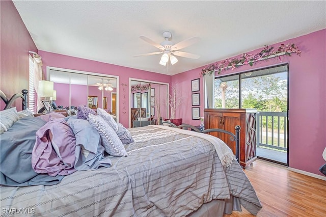 6296 Sugar Bush Ln Unit A, Fort Myers, FL 33908 - bedroom featuring access to outside, two closets, wood finished floors, and ceiling fan