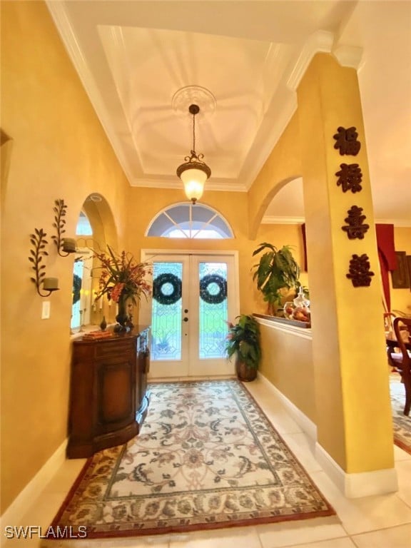 291 Everglades Blvd N, Naples, FL 34120 - tiled foyer featuring french doors, ornamental molding, and arched walkways
