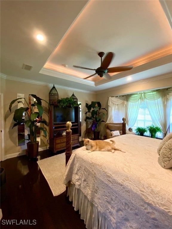 291 Everglades Blvd N, Naples, FL 34120 - bedroom with a tray ceiling, ornamental molding, dark wood-style flooring, and a ceiling fan