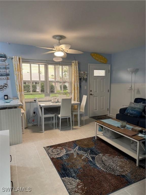 190 N Collier Blvd Unit O4, Marco Island, FL 34145 - living room featuring radiator heating unit, ceiling fan, and light tile patterned flooring