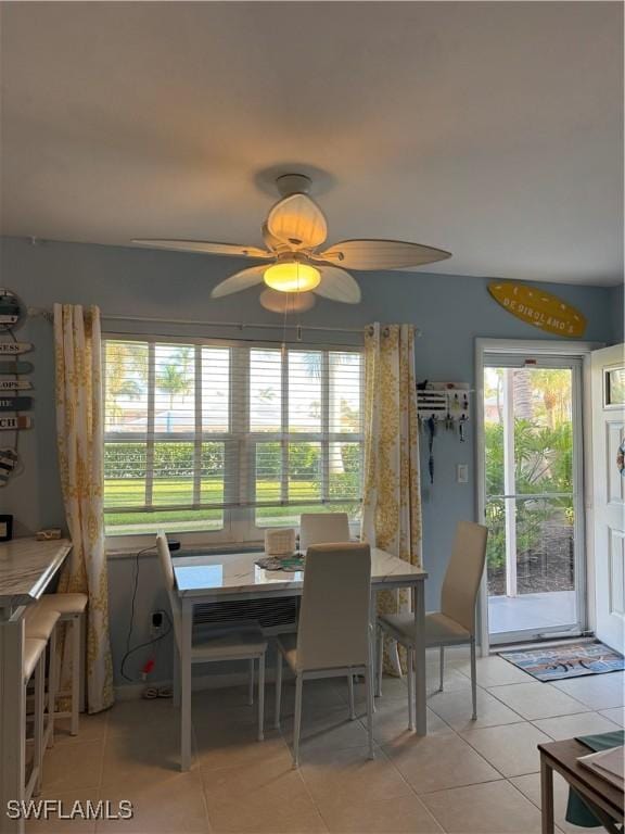 190 N Collier Blvd Unit O4, Marco Island, FL 34145 - dining space featuring tile patterned flooring, plenty of natural light, and a ceiling fan