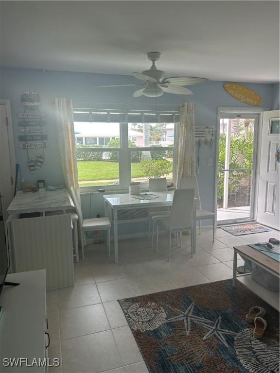 190 N Collier Blvd Unit O4, Marco Island, FL 34145 - dining space featuring light tile patterned floors and ceiling fan