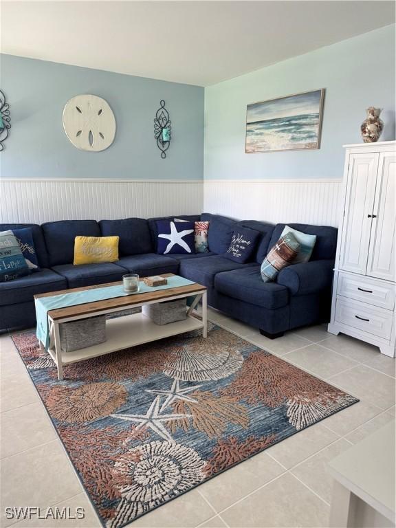 190 N Collier Blvd Unit O4, Marco Island, FL 34145 - living area with tile patterned flooring and wainscoting