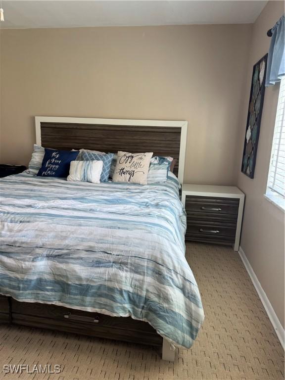 190 N Collier Blvd Unit O4, Marco Island, FL 34145 - carpeted bedroom with baseboards