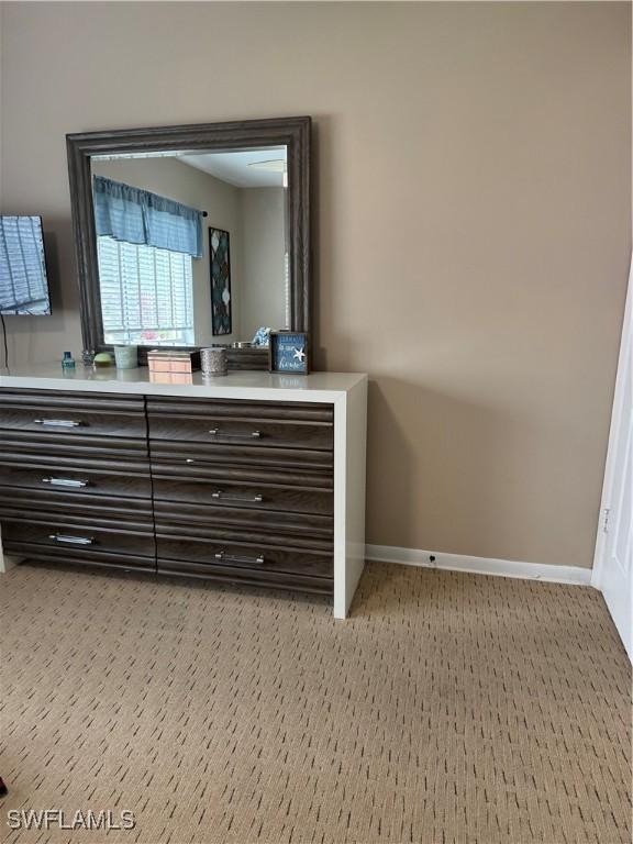 190 N Collier Blvd Unit O4, Marco Island, FL 34145 - detailed view of carpet flooring and baseboards