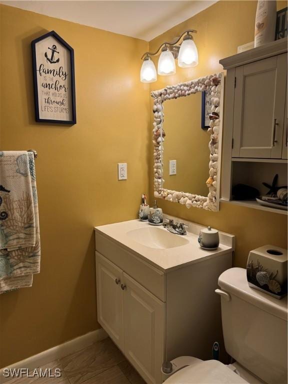 190 N Collier Blvd Unit O4, Marco Island, FL 34145 - half bathroom featuring vanity and toilet