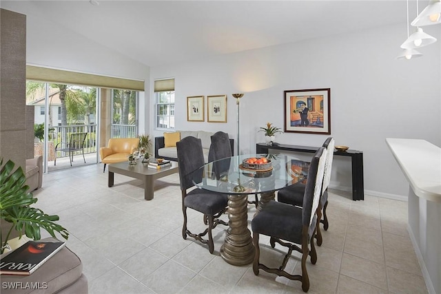 6275 Wilshire Pines Cir Unit 1008, Naples, FL 34109 - dining space with light tile patterned floors and vaulted ceiling