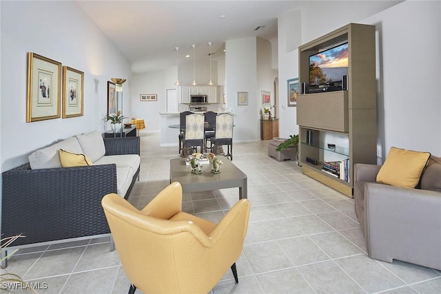 6275 Wilshire Pines Cir Unit 1008, Naples, FL 34109 - living area featuring light tile patterned flooring and high vaulted ceiling