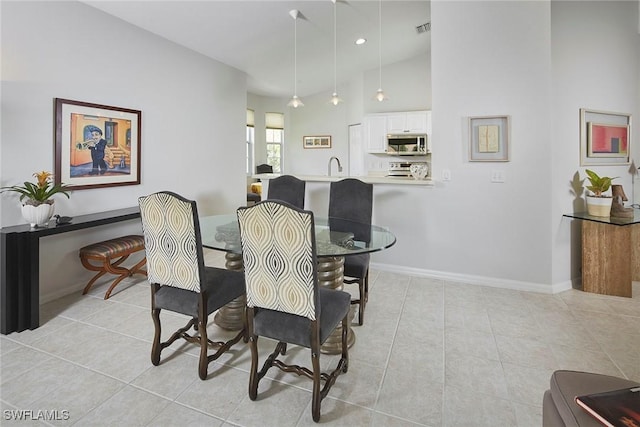 6275 Wilshire Pines Cir Unit 1008, Naples, FL 34109 - dining area featuring light tile patterned flooring and lofted ceiling