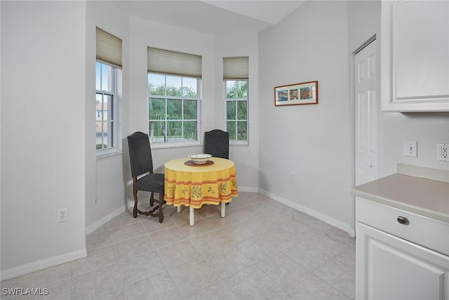 6275 Wilshire Pines Cir Unit 1008, Naples, FL 34109 - sitting room with baseboards and light tile patterned floors