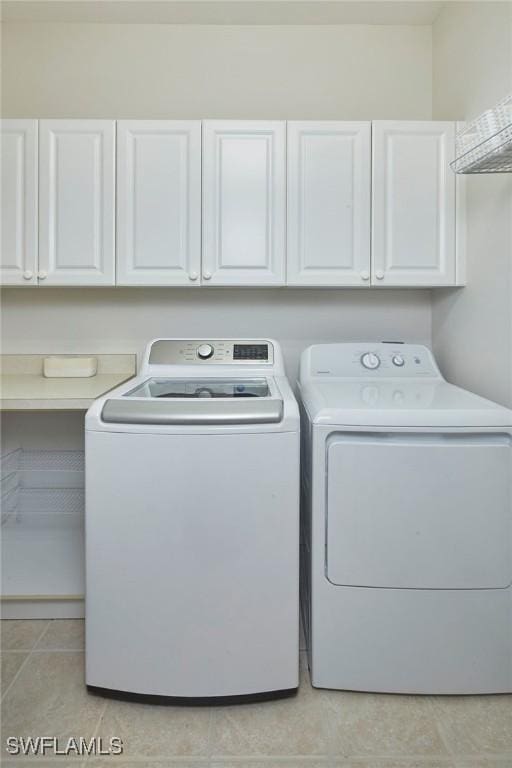 6275 Wilshire Pines Cir Unit 1008, Naples, FL 34109 - laundry area with washing machine and clothes dryer and cabinet space