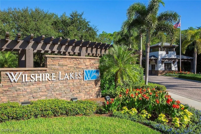 6275 Wilshire Pines Cir Unit 1008, Naples, FL 34109 - view of community / neighborhood sign