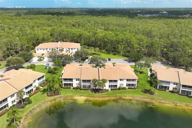 6275 Wilshire Pines Cir Unit 1008, Naples, FL 34109 - bird's eye view of a forest and a nearby body of water