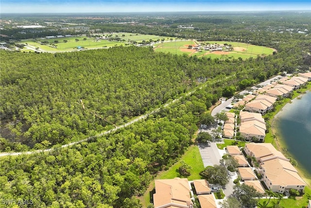 6275 Wilshire Pines Cir Unit 1008, Naples, FL 34109 - bird's eye view of a heavily wooded area and a large body of water
