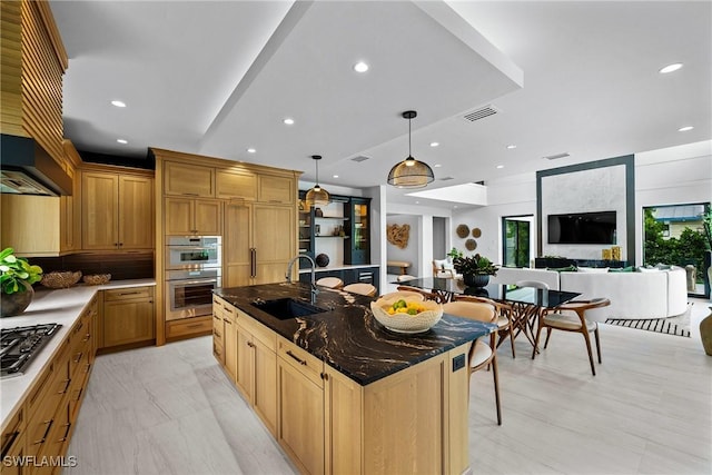 1261 13th Ave N, Naples, FL 34102 - kitchen featuring custom exhaust hood, appliances with stainless steel finishes, an island with sink, decorative light fixtures, and recessed lighting