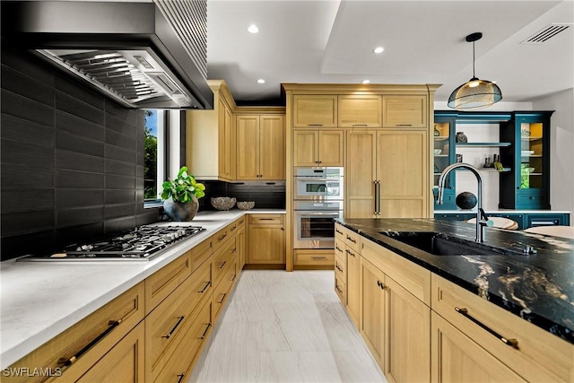 1261 13th Ave N, Naples, FL 34102 - kitchen with wall chimney range hood, recessed lighting, decorative backsplash, appliances with stainless steel finishes, and dark stone counters