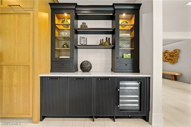 1261 13th Ave N, Naples, FL 34102 - bar area with wine cooler and tasteful backsplash