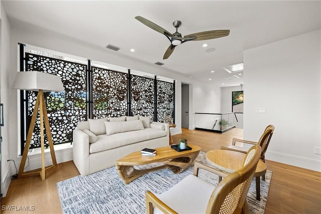 1261 13th Ave N, Naples, FL 34102 - living room featuring a ceiling fan, light wood-type flooring, and recessed lighting