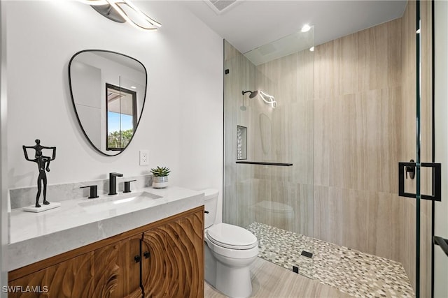 1261 13th Ave N, Naples, FL 34102 - bathroom featuring a tile shower and vanity