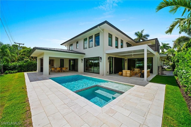 1261 13th Ave N, Naples, FL 34102 - rear view of property with a patio, an outdoor living space, a lawn, and stucco siding