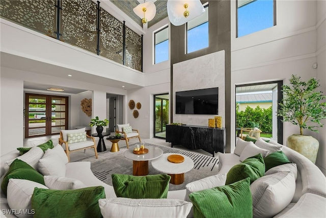 1261 13th Ave N, Naples, FL 34102 - living room featuring plenty of natural light and a towering ceiling