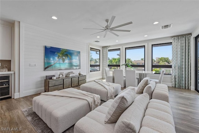 434 Trade Winds Ave, Naples, FL 34108 - bedroom featuring beverage cooler, wood finished floors, recessed lighting, and a ceiling fan