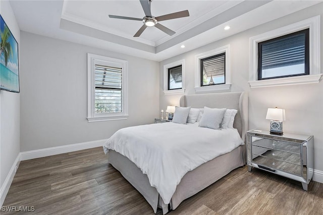 434 Trade Winds Ave, Naples, FL 34108 - bedroom featuring wood finished floors, a raised ceiling, crown molding, recessed lighting, and ceiling fan