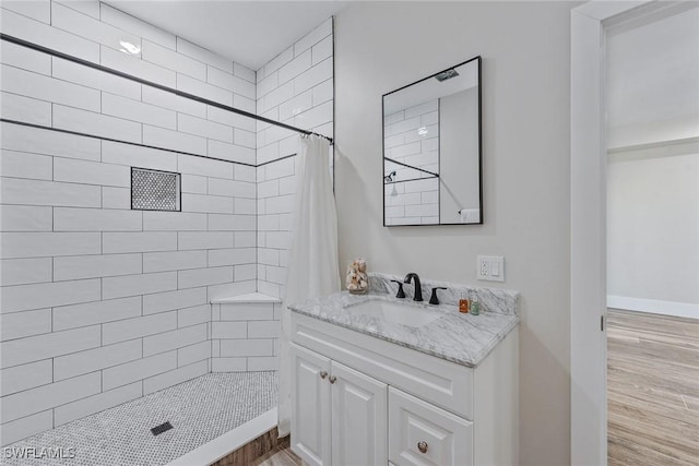 434 Trade Winds Ave, Naples, FL 34108 - full bath featuring wood finished floors, tiled shower, and vanity