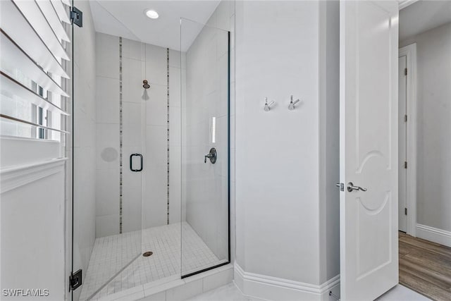 434 Trade Winds Ave, Naples, FL 34108 - bathroom with a stall shower, wood finished floors, and recessed lighting