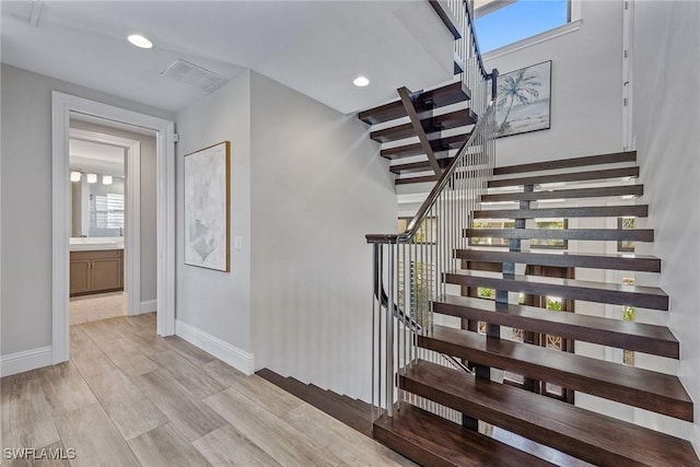 434 Trade Winds Ave, Naples, FL 34108 - stairs featuring wood finished floors and recessed lighting