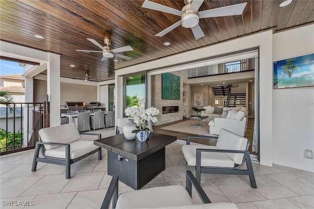 434 Trade Winds Ave, Naples, FL 34108 - view of patio / terrace with ceiling fan, an outdoor hangout area, and an outdoor kitchen