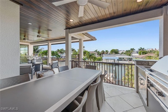 434 Trade Winds Ave, Naples, FL 34108 - view of patio with a ceiling fan, area for grilling, a water view, and outdoor dining space