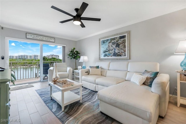 1208 Edington Pl Unit E204, Marco Island, FL 34145 - living area featuring ornamental molding, ceiling fan, and a water view