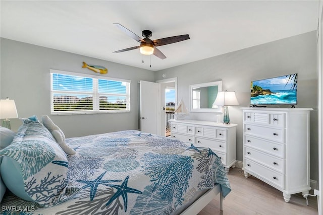 1208 Edington Pl Unit E204, Marco Island, FL 34145 - bedroom with light wood-style flooring and ceiling fan