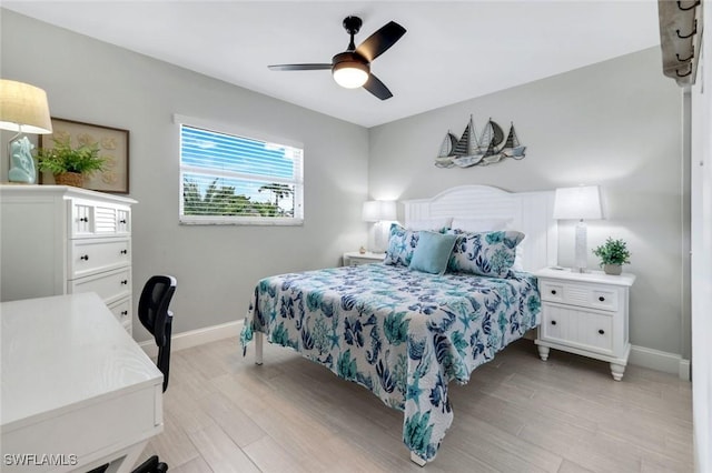 1208 Edington Pl Unit E204, Marco Island, FL 34145 - bedroom featuring light wood-type flooring and a ceiling fan