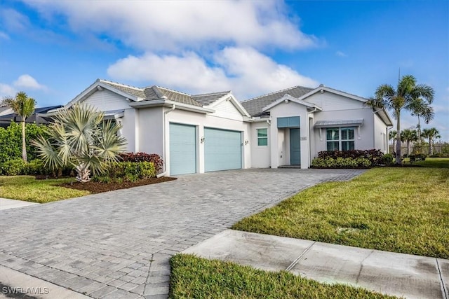9088 Caicos Way, Naples, FL 34114 - single story home with a garage, decorative driveway, stucco siding, a front lawn, and a tile roof