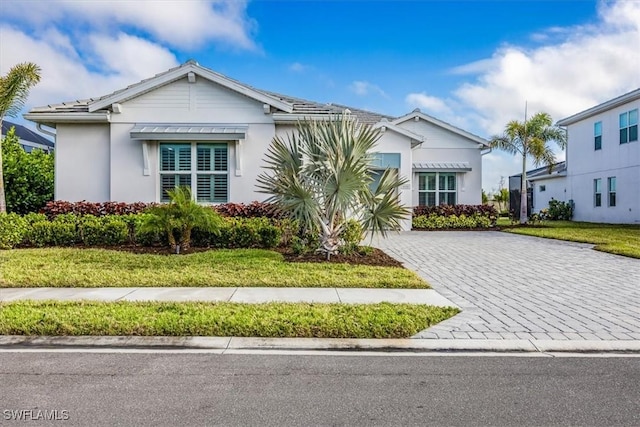 9088 Caicos Way, Naples, FL 34114 - view of front of home with decorative driveway and stucco siding