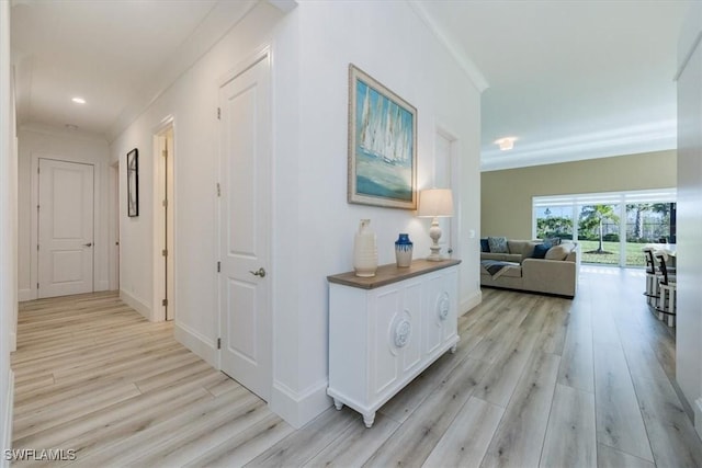 9088 Caicos Way, Naples, FL 34114 - hallway featuring light wood finished floors, crown molding, and recessed lighting