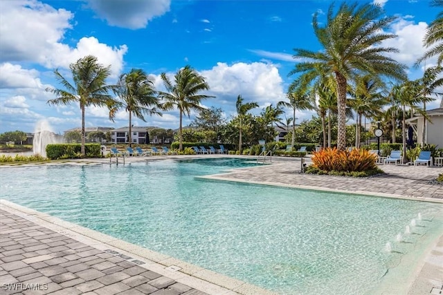 9088 Caicos Way, Naples, FL 34114 - community pool with a patio area